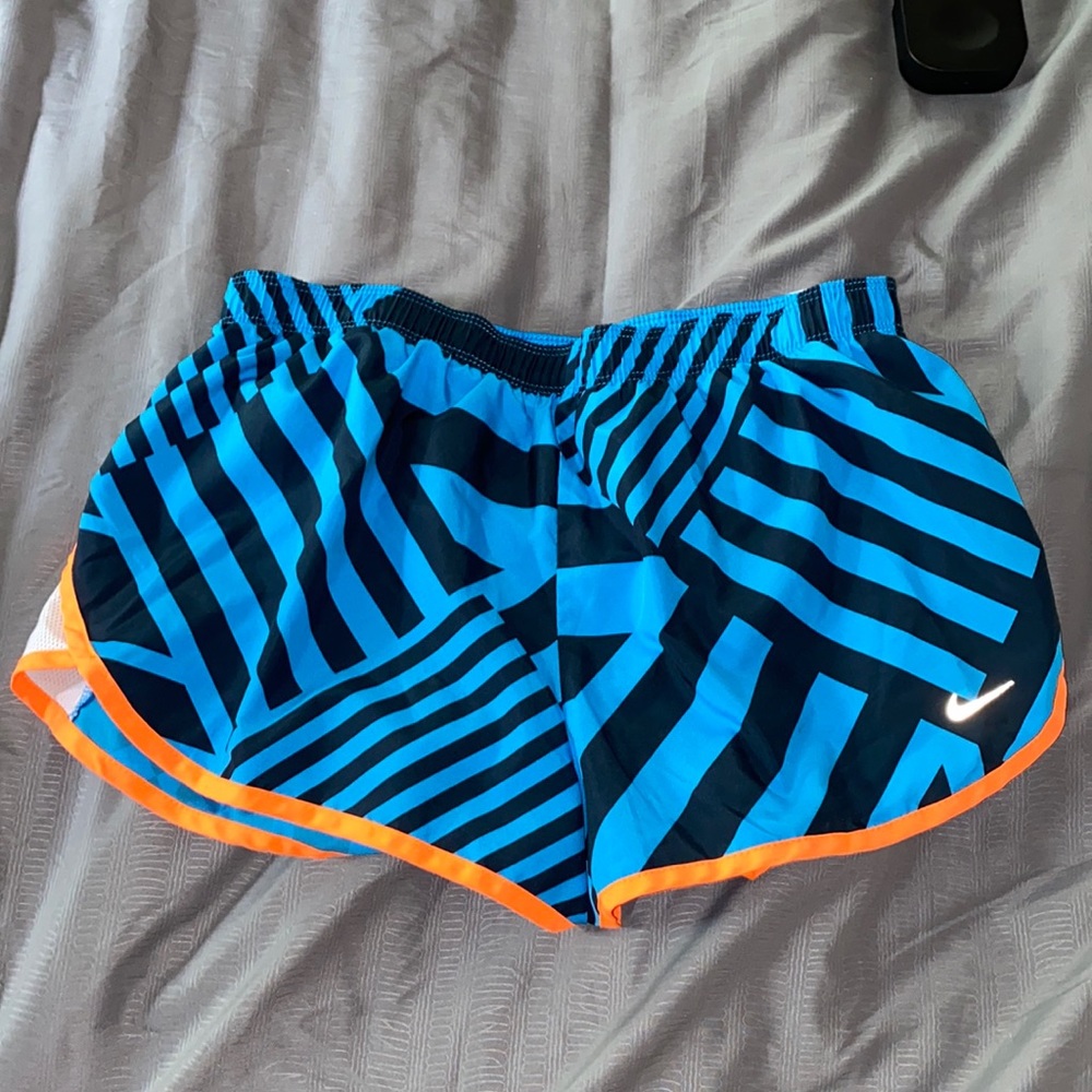 blue and orange patterned Nike shorts